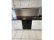 Close-up of kitchen showcasing granite countertops and a stainless steel dishwasher at 3827 E Sweetwater Ave, Phoenix, AZ 85032