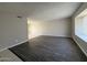 Spacious living room featuring modern floors and a window with natural light at 3827 E Sweetwater Ave, Phoenix, AZ 85032