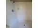 Close-up of walk-in shower featuring tiled surround at 3827 E Sweetwater Ave, Phoenix, AZ 85032