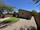 View of the backyard with gravel landscaping, and lawn at 4632 E Melinda Ln, Phoenix, AZ 85050
