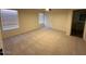 Primary bedroom with neutral carpet, natural light, and ensuite bathroom at 4632 E Melinda Ln, Phoenix, AZ 85050
