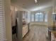 Bright open kitchen and dining area with stainless steel appliances and breakfast nook at 4632 E Melinda Ln, Phoenix, AZ 85050