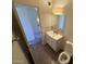 Here is a bathroom with an open door to the hallway at 4849 W Northern Ave, Glendale, AZ 85301