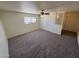 Spacious bedroom with a ceiling fan and carpet flooring with bright natural light at 4849 W Northern Ave, Glendale, AZ 85301
