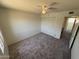 Carpeted bedroom featuring a ceiling fan and large closet provides a cozy retreat at 4849 W Northern Ave, Glendale, AZ 85301