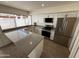 The kitchen features stainless steel appliances, ample counter space, and modern white cabinetry at 4849 W Northern Ave, Glendale, AZ 85301