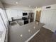Kitchen features new stainless steel appliances and a spacious breakfast bar countertop at 4849 W Northern Ave, Glendale, AZ 85301