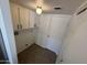 The laundry room has a tiled floor, cabinets, and a light at 4849 W Northern Ave, Glendale, AZ 85301