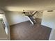 Open-concept living room features tile flooring, natural light, and a staircase leading to the upper level at 4849 W Northern Ave, Glendale, AZ 85301