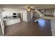 Bright and airy living room flows into the kitchen, offering a seamless transition for modern living at 4849 W Northern Ave, Glendale, AZ 85301