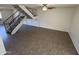 The open living room features durable tile flooring and a staircase, combining style and functionality at 4849 W Northern Ave, Glendale, AZ 85301