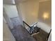 Carpeted staircase leads to a bright bedroom, enhancing the home's vertical flow and style at 4849 W Northern Ave, Glendale, AZ 85301