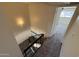 Carpeted staircase descends into a room, providing seamless flow between living spaces and comfort at 4849 W Northern Ave, Glendale, AZ 85301