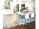 Spacious kitchen featuring a large island with seating, stainless steel appliances, and contemporary finishes at 501 E Ray Rd # 230, Chandler, AZ 85225