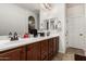 Bathroom featuring double sinks with cabinets, offering plenty of storage and counter space at 5235 S Dante --, Mesa, AZ 85212