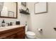 This bathroom features a single sink with a vanity and a toilet at 5235 S Dante --, Mesa, AZ 85212