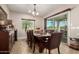 Elegant dining room featuring a stylish chandelier and sliding glass doors to the patio at 5235 S Dante --, Mesa, AZ 85212