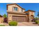 Charming two-story home with a two-car garage and stone accents on the facade at 5235 S Dante --, Mesa, AZ 85212