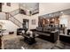Open-concept living room with tile flooring, staircase, and seamless flow to the kitchen at 5235 S Dante --, Mesa, AZ 85212
