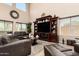 Inviting living room with soaring ceilings, abundant natural light, and a cozy feel at 5235 S Dante --, Mesa, AZ 85212