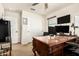This office features a large desk with marble countertops and a flat-screen TV at 5235 S Dante --, Mesa, AZ 85212