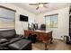 This office has a large desk, a comfortable chair, and a sofa with an ottoman at 5235 S Dante --, Mesa, AZ 85212