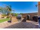 Outdoor kitchen featuring a stainless steel grill, countertop, and adjacent artificial grass at 5235 S Dante --, Mesa, AZ 85212