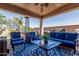 Cozy covered patio with comfortable seating, a ceiling fan, and a decorative rug at 5235 S Dante --, Mesa, AZ 85212