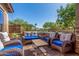 Comfortable covered patio with stylish outdoor seating perfect for enjoying the neighborhood views at 5235 S Dante --, Mesa, AZ 85212