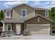 Charming two-story home showcasing stone accents and a neutral color palette at 5992 E Artemis Dr, Florence, AZ 85132