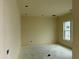 Bright bedroom with a large window and neutral walls at 6446 E Omega Cir, Mesa, AZ 85215