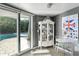 Dining room with sliding glass doors and views of the pool at 7030 E Orange Blossom Ln, Paradise Valley, AZ 85253