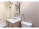 A basic bathroom featuring a white sink, toilet, and a shower with a vintage-style shower head at 705 S Pima --, Mesa, AZ 85210