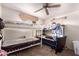 A simple bedroom with bunk beds and a ceiling fan providing a practical living space at 705 S Pima --, Mesa, AZ 85210