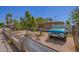 View of the home's front yard, featuring mature trees and a charming fence at 705 S Pima --, Mesa, AZ 85210