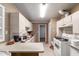 Functional kitchen features white appliances and plenty of counter space at 705 S Pima --, Mesa, AZ 85210
