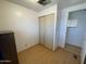 Bedroom with hardwood floors, closet, and window at 7807 E Main St # H-20, Mesa, AZ 85207