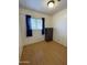 Bedroom featuring hardwood floors, window, dresser, and overhead lighting at 7807 E Main St # H-20, Mesa, AZ 85207