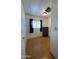 Bedroom featuring hardwood floors, window, dresser, and overhead lighting at 7807 E Main St # H-20, Mesa, AZ 85207