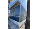 Exterior of home with desert landscaping and blue metal siding at 7807 E Main St # H-20, Mesa, AZ 85207