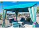 Relaxing outdoor living space with comfortable seating and shade canopy, perfect for enjoying the outdoors at 7807 E Main St # H-20, Mesa, AZ 85207