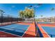 Outdoor community pickleball court surrounded by black chain-link fencing at 7807 E Main St # H-20, Mesa, AZ 85207