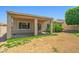 A covered patio enhances this cozy backyard, perfect for outdoor relaxation at 7911 E Posada Ave, Mesa, AZ 85212