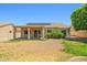 View of backyard with covered patio and solar panels on the roof of the property at 7911 E Posada Ave, Mesa, AZ 85212
