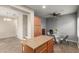 Dining area featuring a ceiling fan, glass table, and seating for four at 8468 W Lewis Ave, Phoenix, AZ 85037