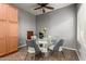 Dining area featuring modern light fixture and seating for four at 8468 W Lewis Ave, Phoenix, AZ 85037