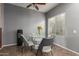Dining area featuring modern light fixture and seating for four at 8468 W Lewis Ave, Phoenix, AZ 85037