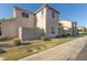 Attractive two-story home with a well-kept lawn, privacy fence, and appealing architectural details at 8468 W Lewis Ave, Phoenix, AZ 85037