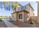 Charming two-story home featuring low-maintenance landscaping, a well-kept walkway, and an inviting curb appeal at 8468 W Lewis Ave, Phoenix, AZ 85037