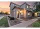 Beautiful two-story home featuring a welcoming entrance and well-maintained landscaping against a vibrant sunset backdrop at 8468 W Lewis Ave, Phoenix, AZ 85037
